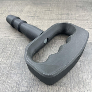 Een adapter voor vac-u-lock seks toys met een zwarte handgreep.