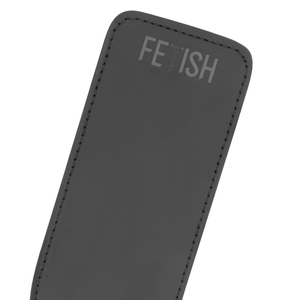 Detail shot of a vegan leather paddle for BDSM in black