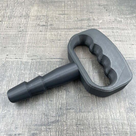 Een adapter voor vac-u-lock seks toys met een zwarte handgreep.