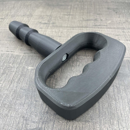 Een adapter voor vac-u-lock seks toys met een zwarte handgreep.