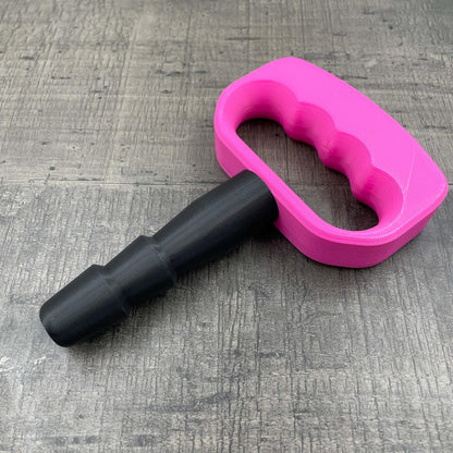Een adapter voor vac-u-lock seks toys met een roze handgreep.