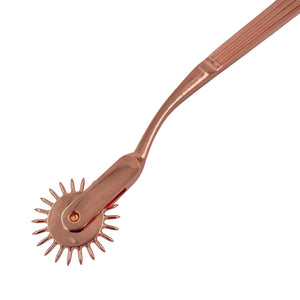 A wartenberg pinwheel for BDSM in rose-gold