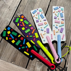 4 BDSM paddles met bouwstenen in verschillende kleuren