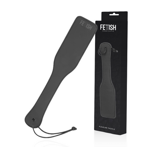 A vegan leather paddle for BDSM in black, with box