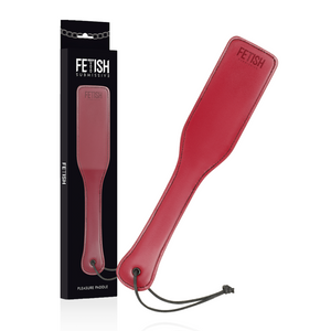 A vegan leather paddle for BDSM in red, with box